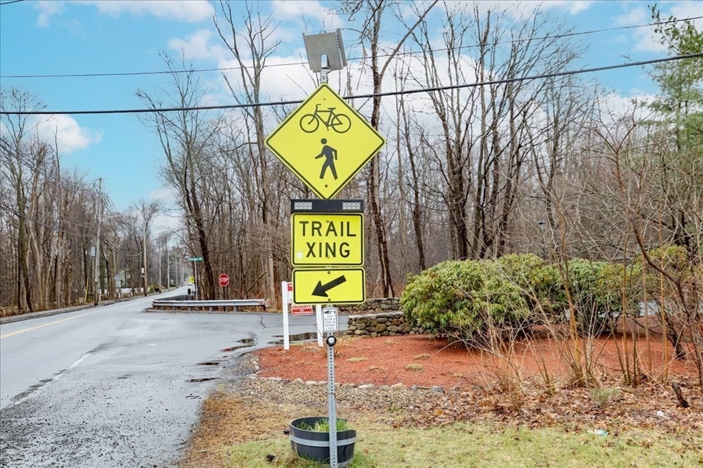 22 Collins Street, Unit 46 Danvers, MA 01923 - Photo 36 of 37 a sign that is on a street