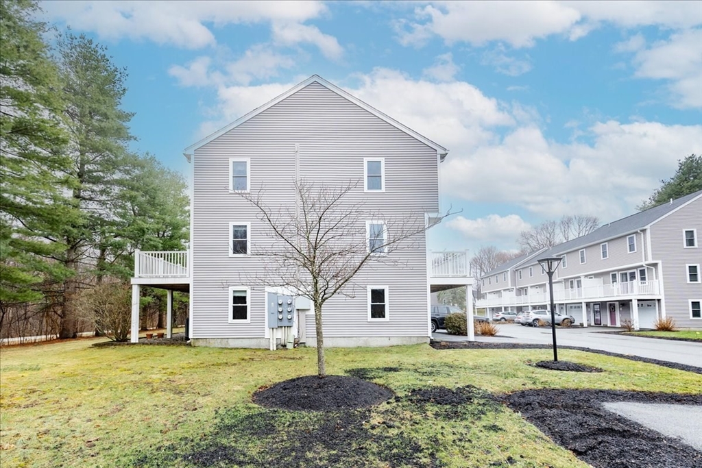 22 Collins Street, Unit 46 Danvers, MA 01923 - Photo 37 of 37 a front view of a house with a yard