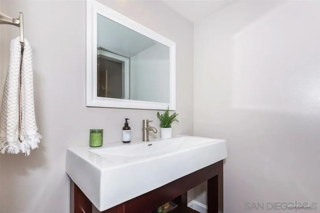 1031 America Way Del Mar, CA 92014 - Photo 13 of 25 a bathroom with a sink and a mirror
