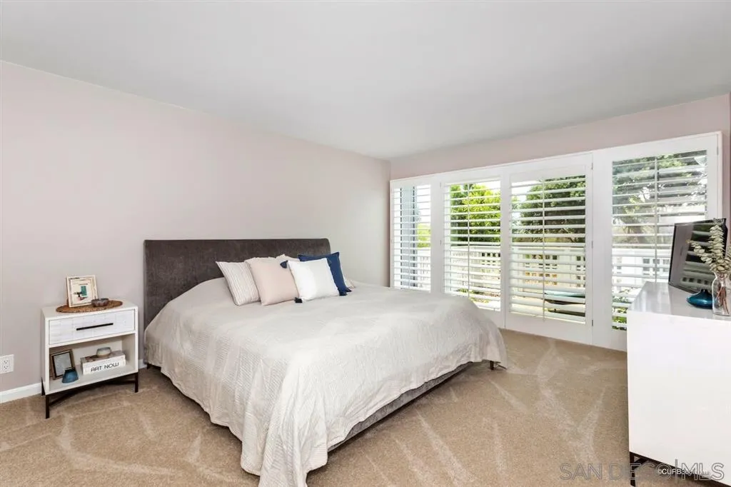 1031 America Way Del Mar, CA 92014 - Photo 14 of 25 a bedroom with a bed and a large window
