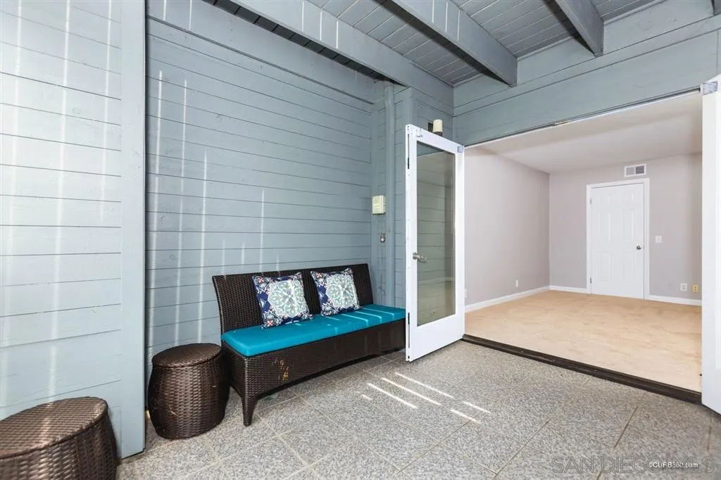 1031 America Way Del Mar, CA 92014 - Photo 19 of 25 a bedroom with a couch and a chair