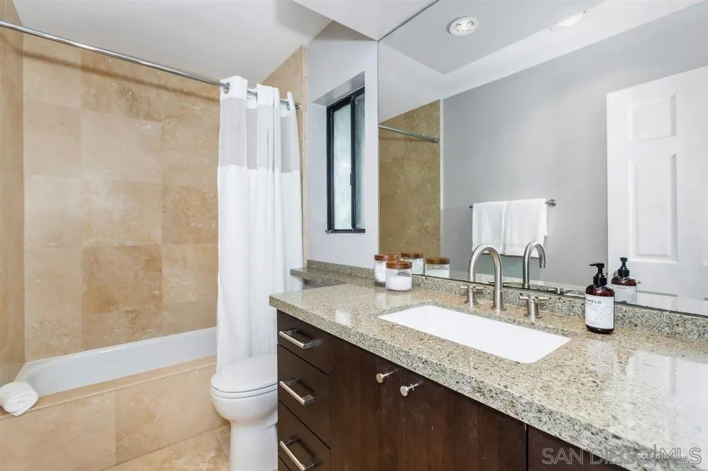 1031 America Way Del Mar, CA 92014 - Photo 20 of 25 a bathroom with a granite countertop sink and a mirror