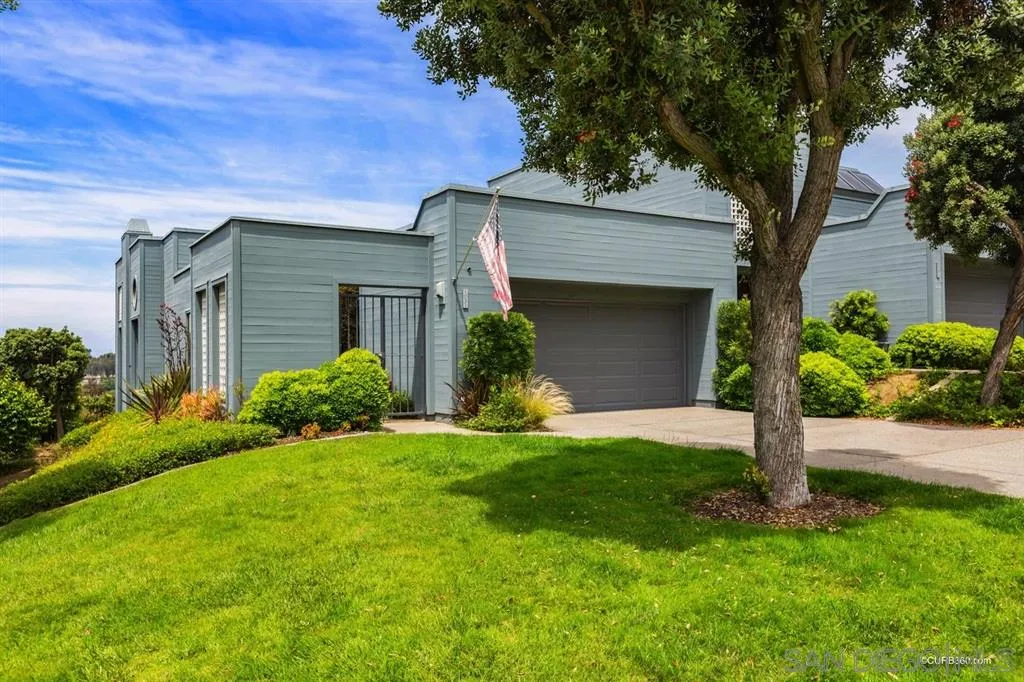 1031 America Way Del Mar, CA 92014 - Photo 22 of 25 a front view of a house with a yard and garage