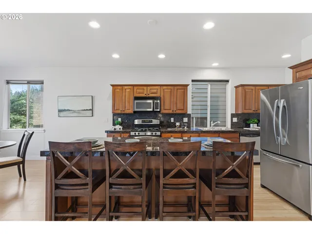 a view of a dining room with furniture window and outside view