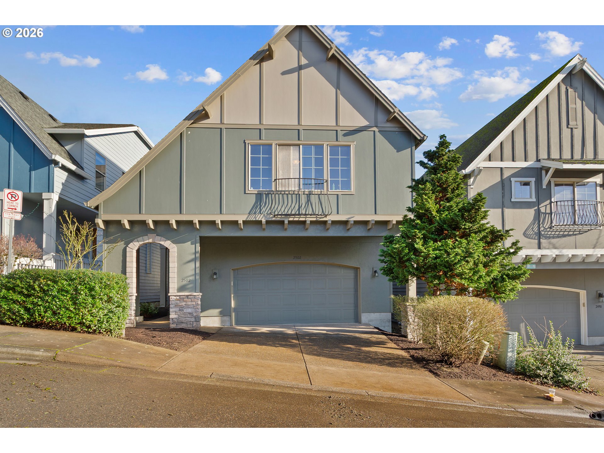 2502 Northwest Parnell Terrace Portland, OR 97229 - Photo 2 of 48 a front view of a house with a yard and garage