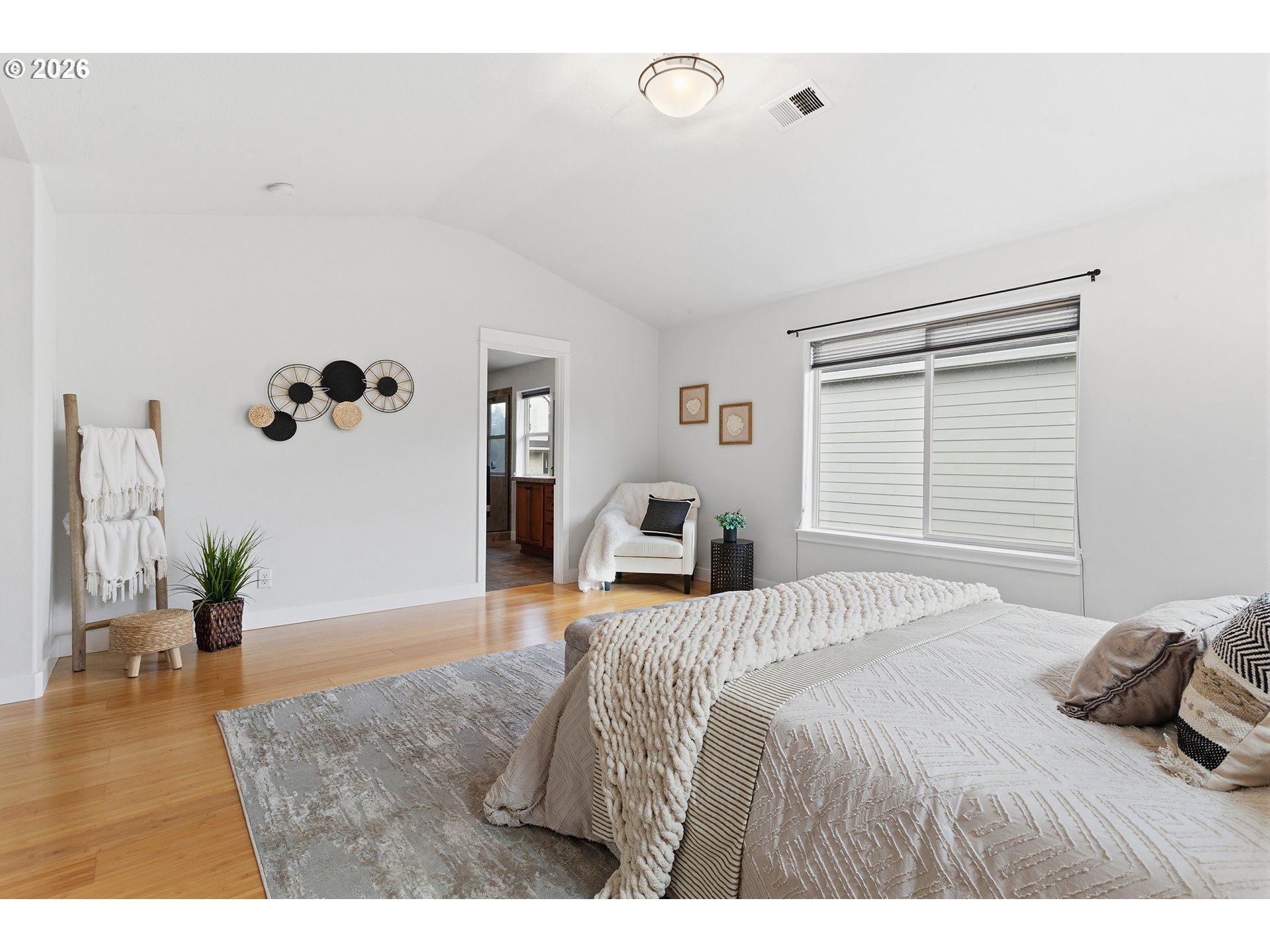 2502 Northwest Parnell Terrace Portland, OR 97229 - Photo 28 of 48 a bedroom with a bed and wooden floor