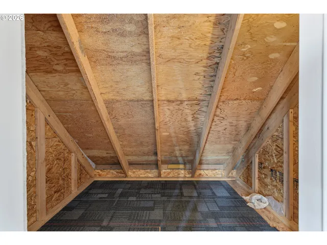 a view of a balcony with wooden floor