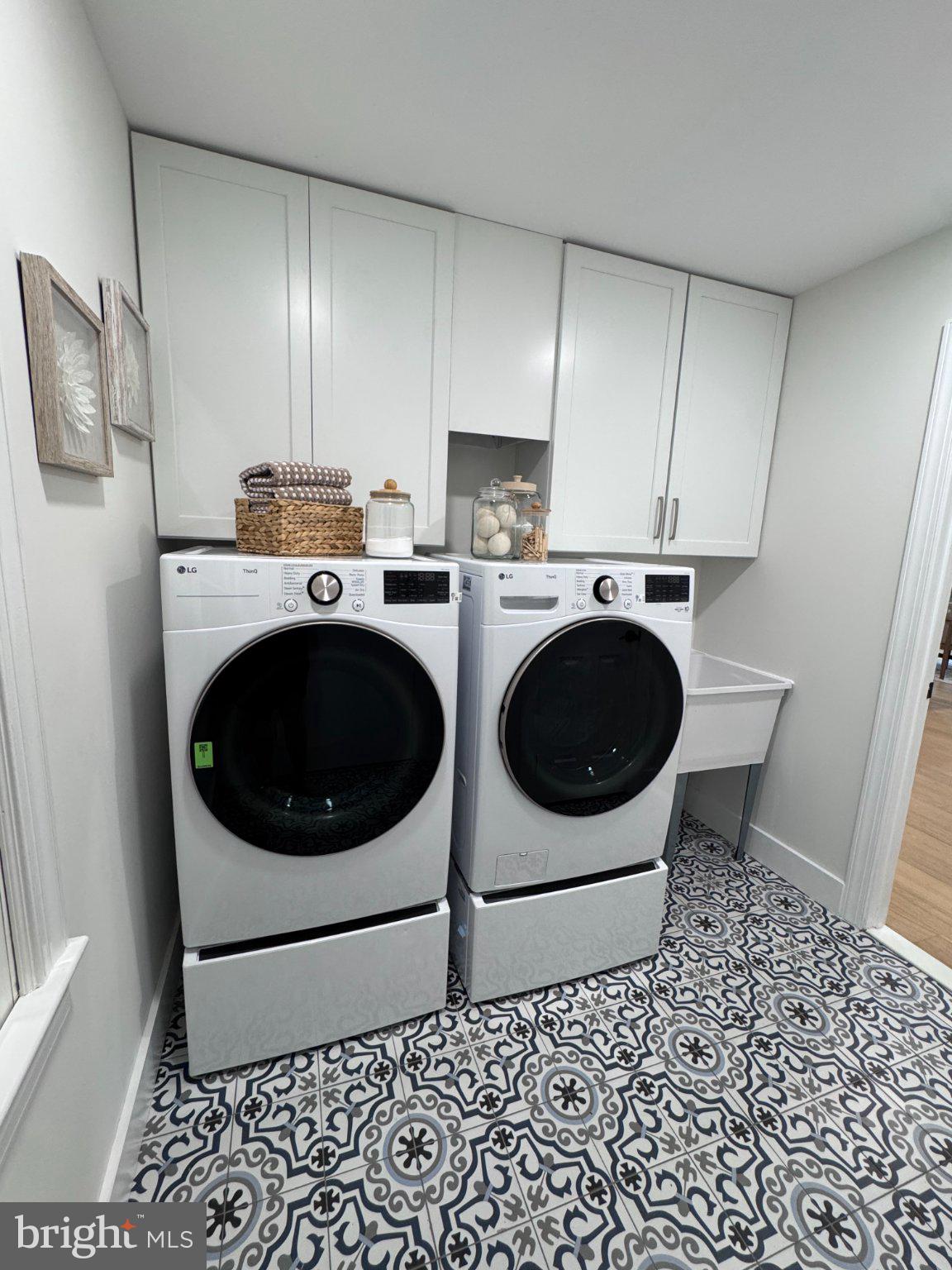 1132 Springvale Road Great Falls, VA 22066 - Photo 18 of 18 Modern laundry space with stylish tiles.