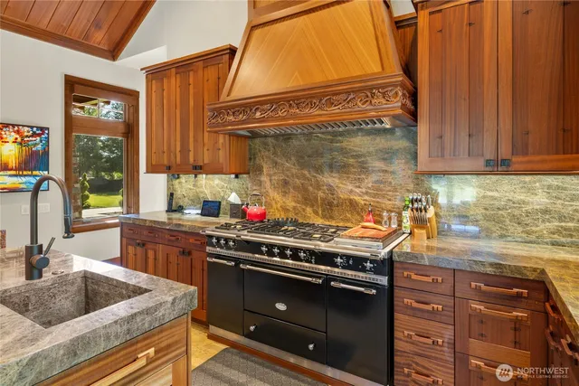 a kitchen with a stove and a sink