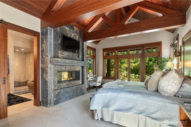 a bedroom with a bed and a fireplace