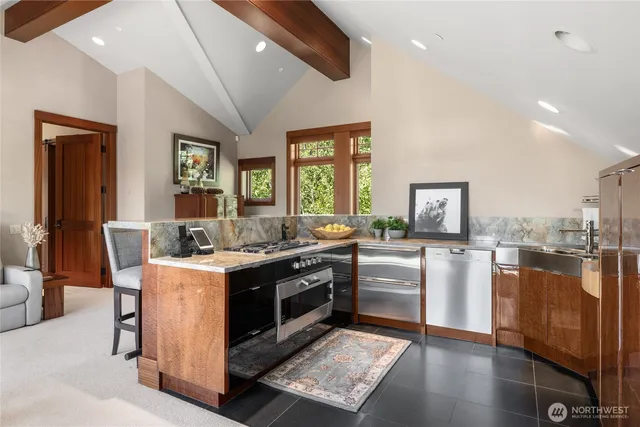 a kitchen with a stove and cabinets