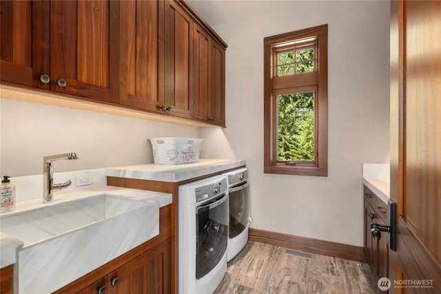 a view of a kitchen with fridge and wooden floor