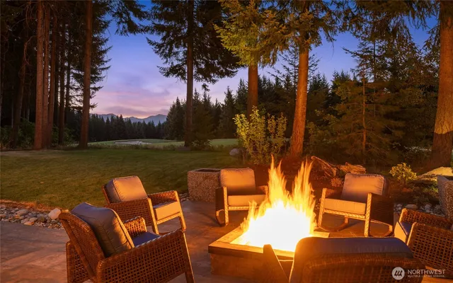 a view of chairs and table in a lake