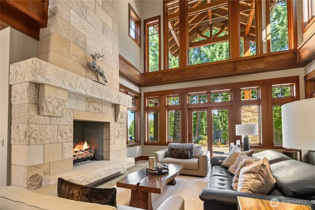 a living room with furniture or fireplace and floor to ceiling windows