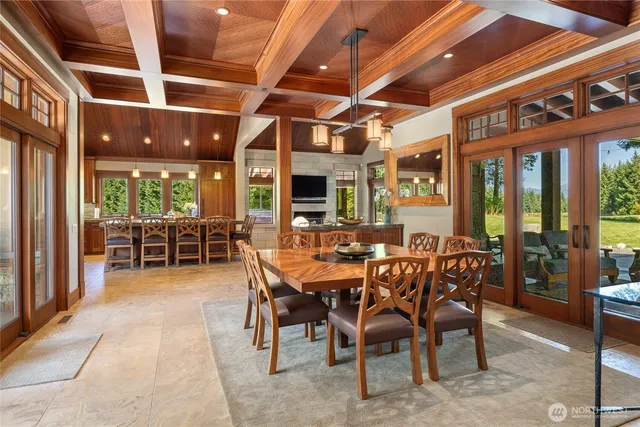 a view of a dining room with furniture window and outside view