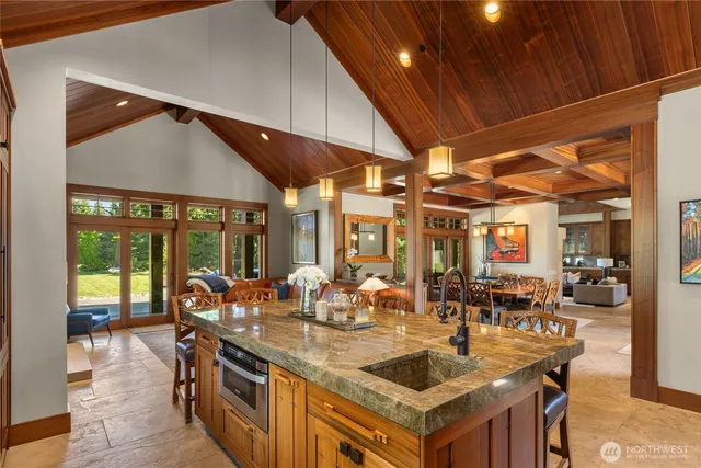 a kitchen with counter top space and windows
