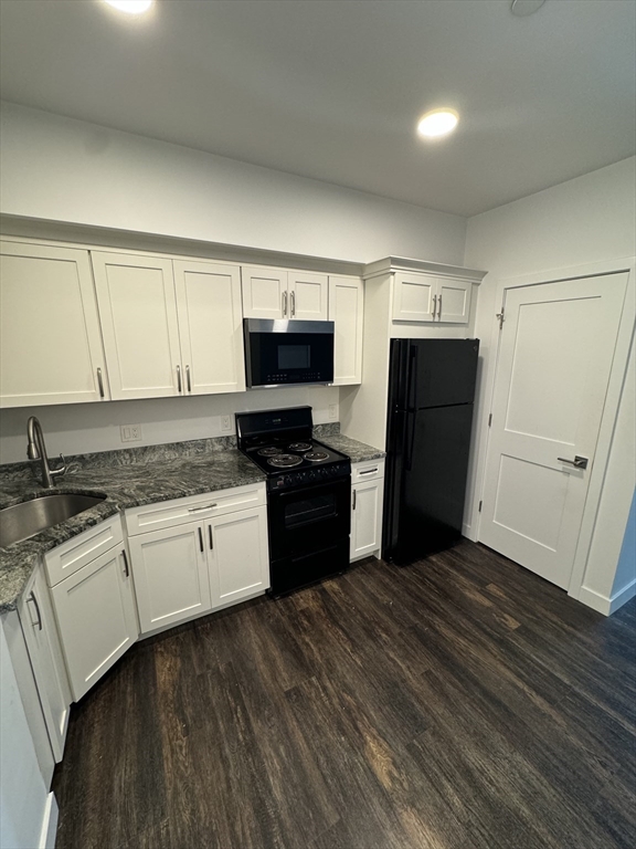 6 Needhams Landing Road, Unit 503 Lynn, MA 01905 - Photo 2 of 9 a kitchen with granite countertop a refrigerator stove and sink