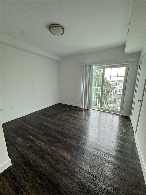 6 Needhams Landing Road, Unit 503 Lynn, MA 01905 - Photo 7 of 9 wooden floor in an empty room with a window