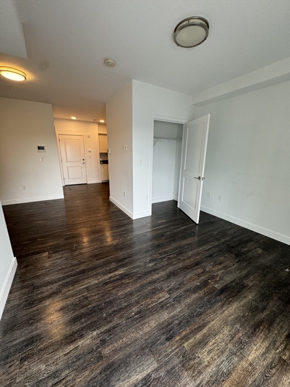 6 Needhams Landing Road, Unit 503 Lynn, MA 01905 - Photo 9 of 9 an empty room with wooden floor and windows