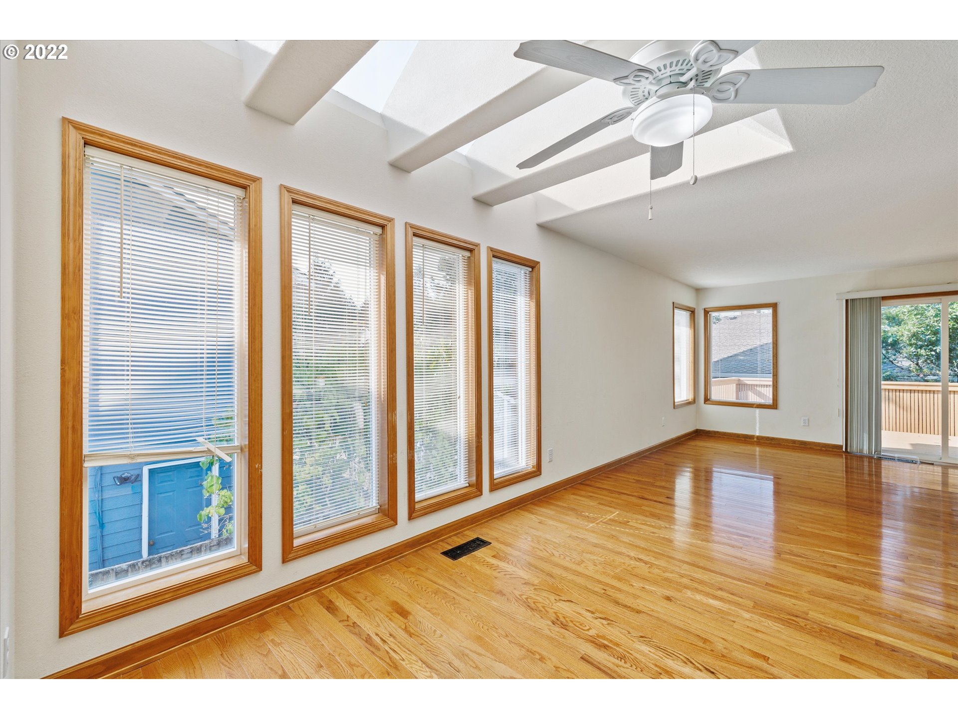 36930 Eldridge Drive Sandy, OR 97055 - Photo 14 of 32 a view of an empty room with window and wooden floor
