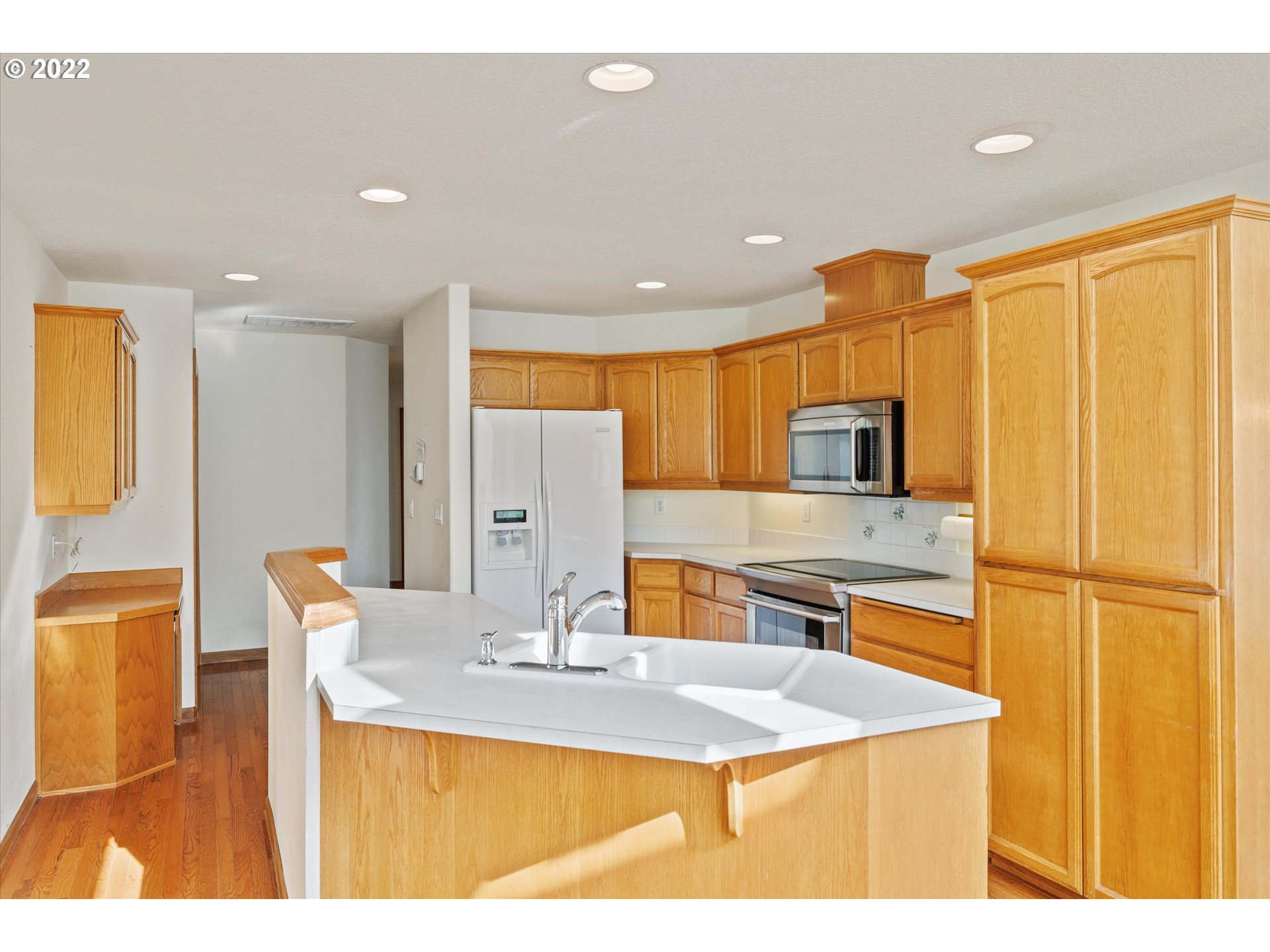 36930 Eldridge Drive Sandy, OR 97055 - Photo 17 of 32 a kitchen with stainless steel appliances a sink and a refrigerator
