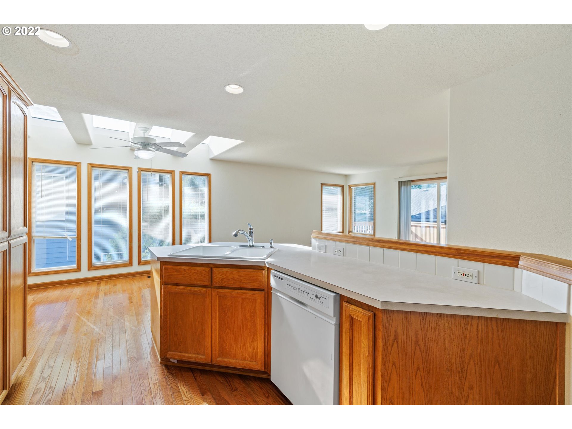 36930 Eldridge Drive Sandy, OR 97055 - Photo 20 of 32 a kitchen with stainless steel appliances granite countertop a sink and a wooden floor
