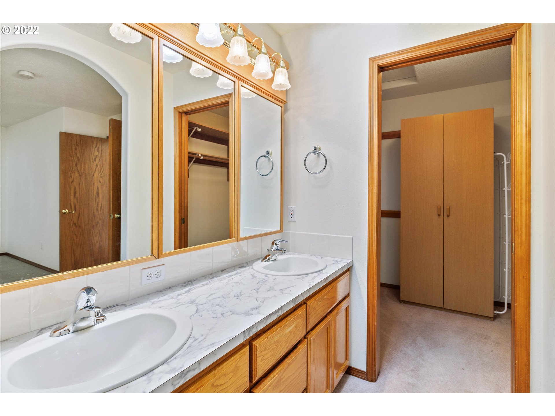 36930 Eldridge Drive Sandy, OR 97055 - Photo 23 of 32 a bathroom with a granite countertop sink and a mirror