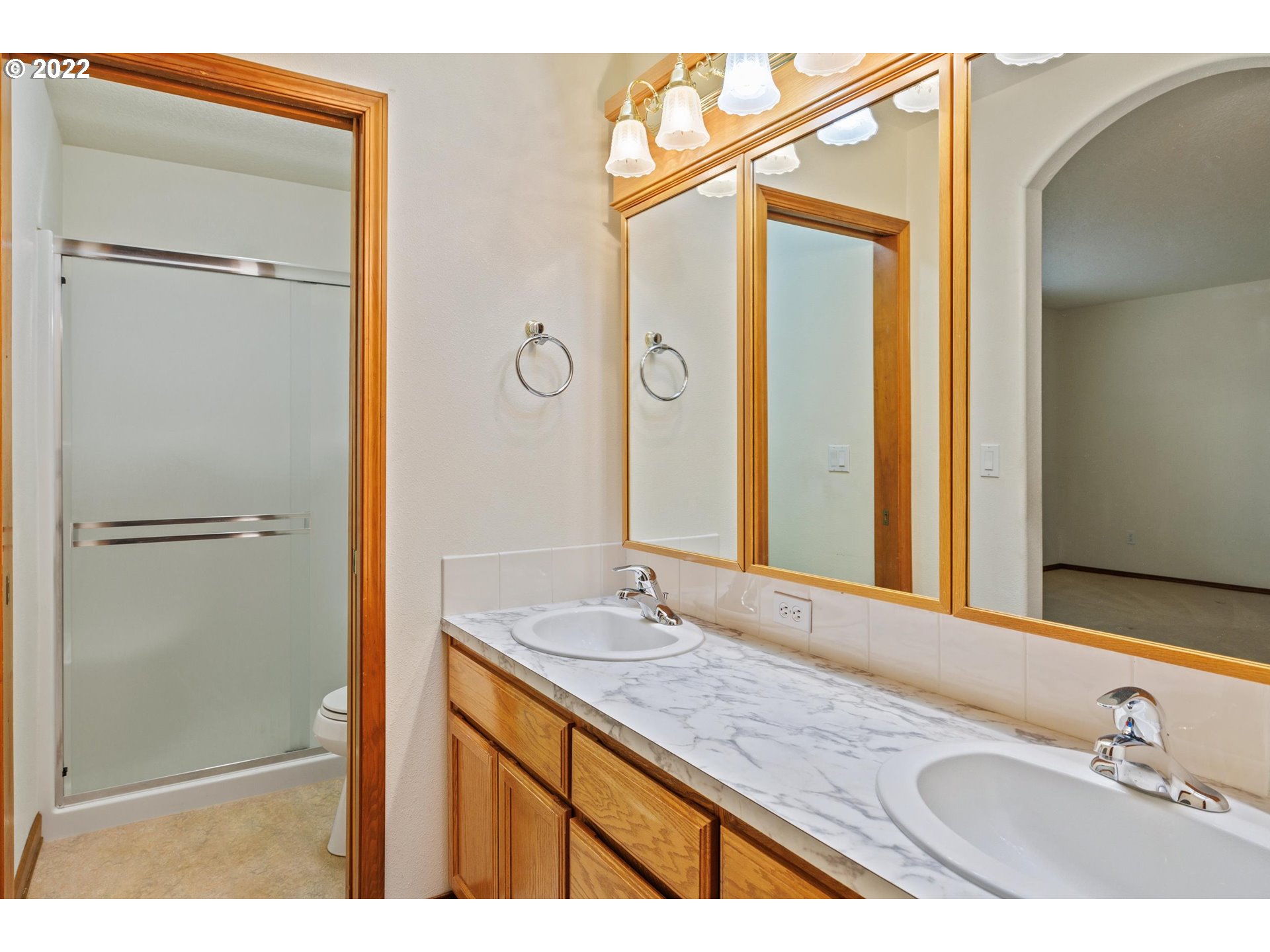 36930 Eldridge Drive Sandy, OR 97055 - Photo 24 of 32 a bathroom with a granite countertop sink mirror and a shower