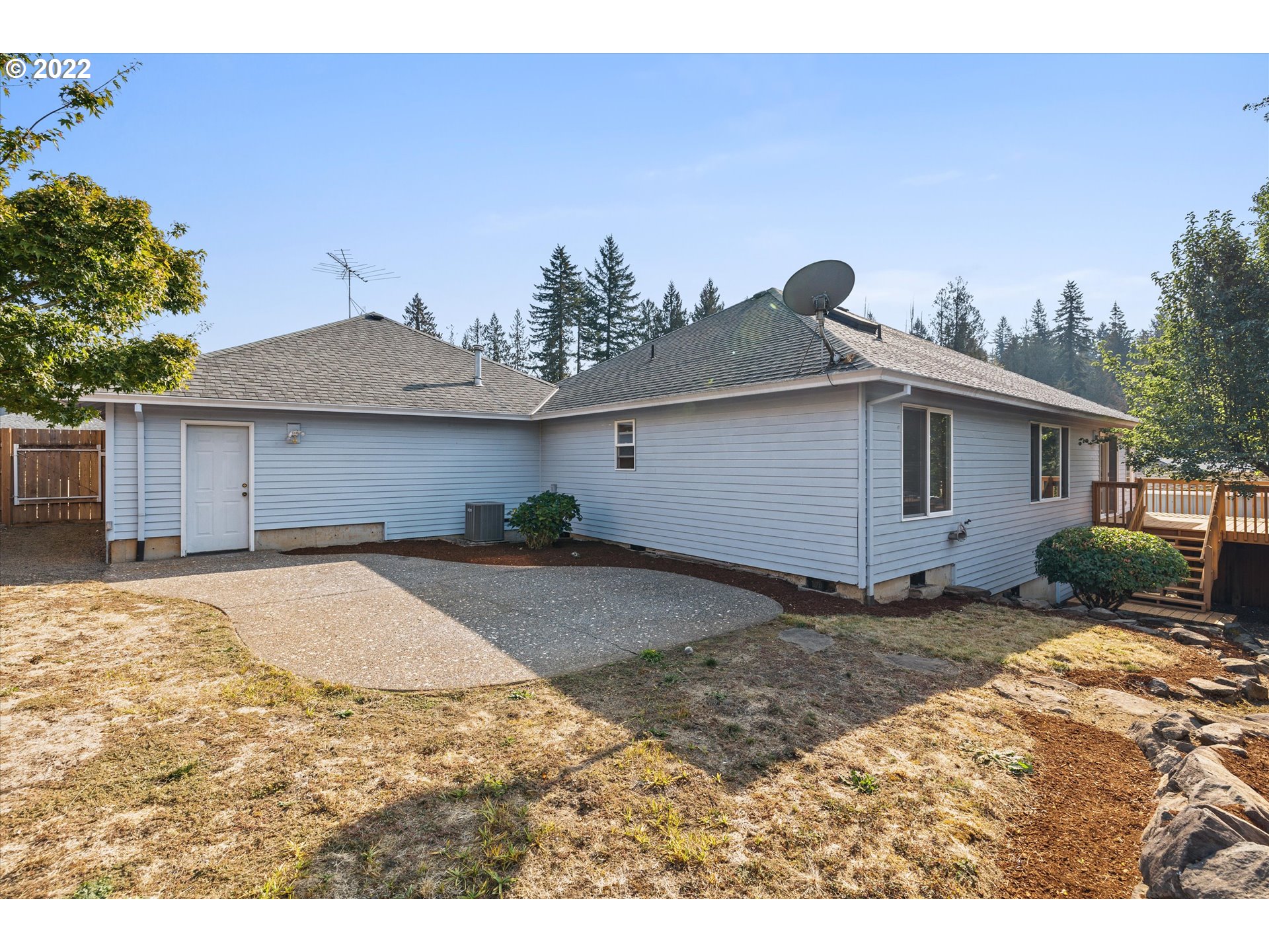 36930 Eldridge Drive Sandy, OR 97055 - Photo 31 of 32 a backyard of a house with table and chairs