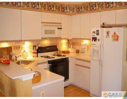 159 Salem Road North Brunswick, NJ 08902 - Photo 2 of 8 a kitchen with a sink and cabinets