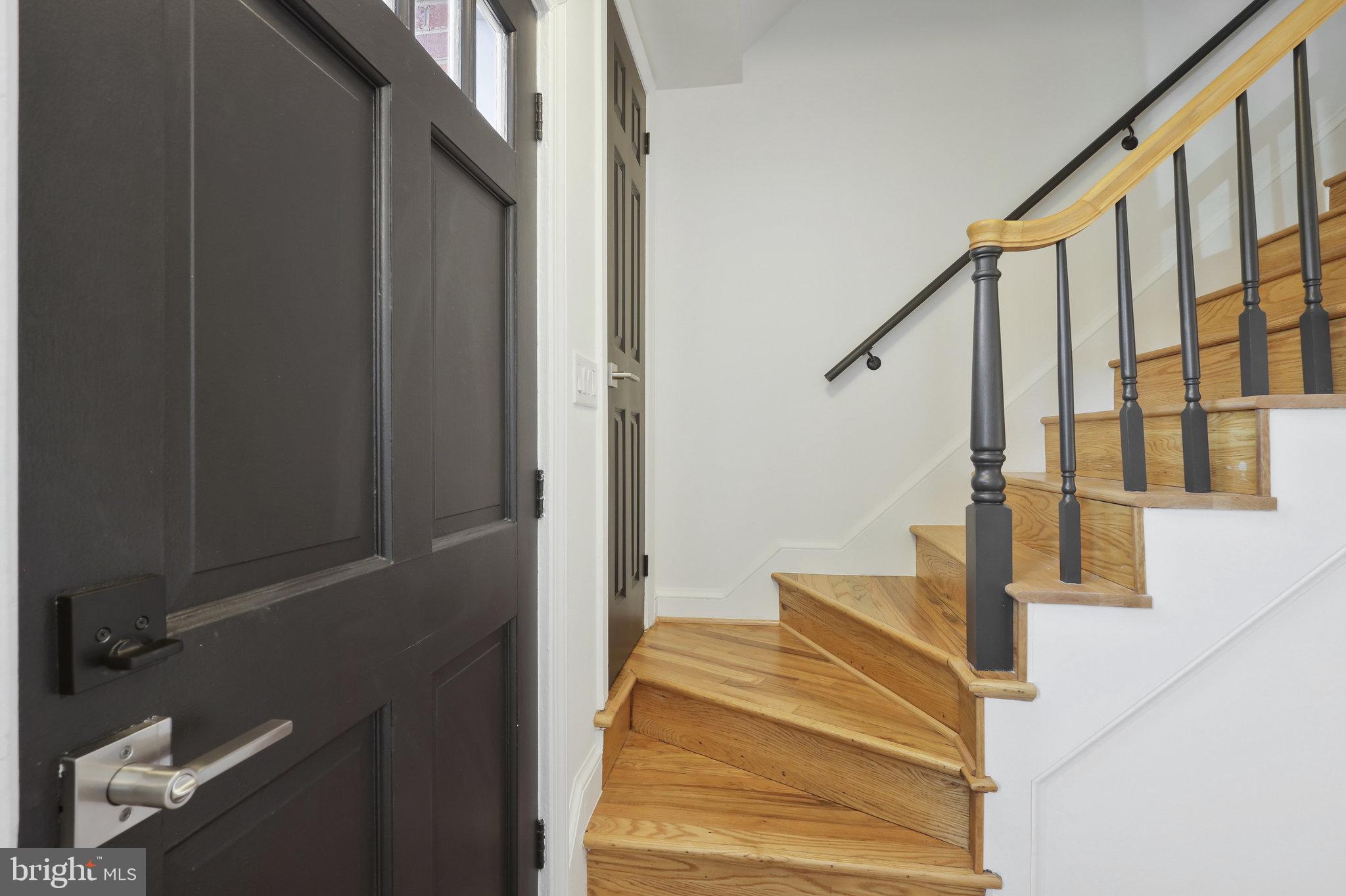 116 Commerce Street Alexandria, VA 22314 - Photo 10 of 50 Inviting entryway with elegant stairs.