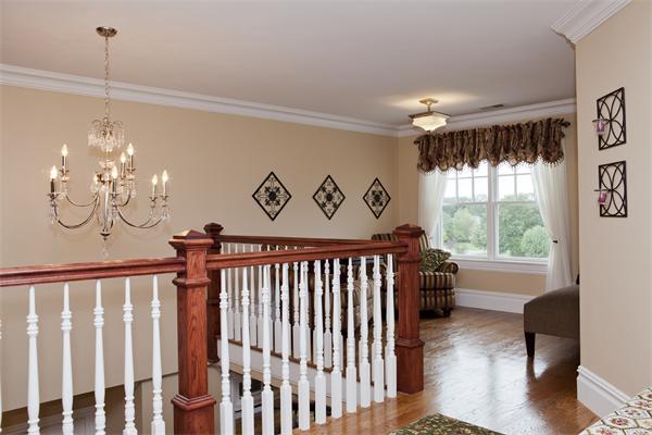 11 Cranberry Lane Hingham, MA 02043 - Photo 12 of 16 a view of a porch with furniture wooden floor and chandelier