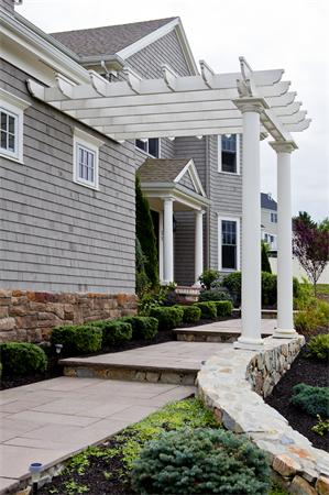 11 Cranberry Lane Hingham, MA 02043 - Photo 13 of 16 a front view of a house with a yard and potted plants