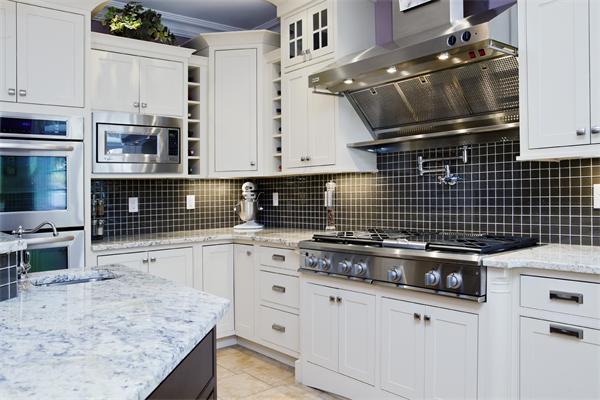11 Cranberry Lane Hingham, MA 02043 - Photo 7 of 16 a kitchen with granite countertop a sink stove and cabinets