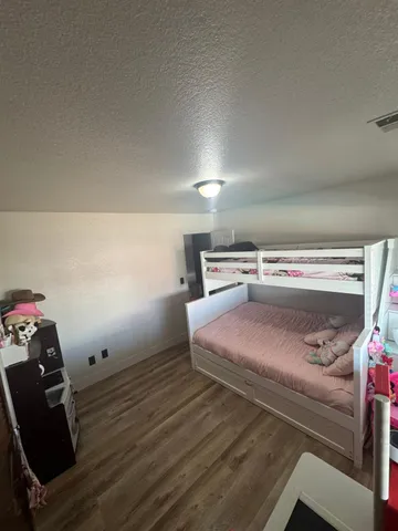 a room with furniture and a wooden floor