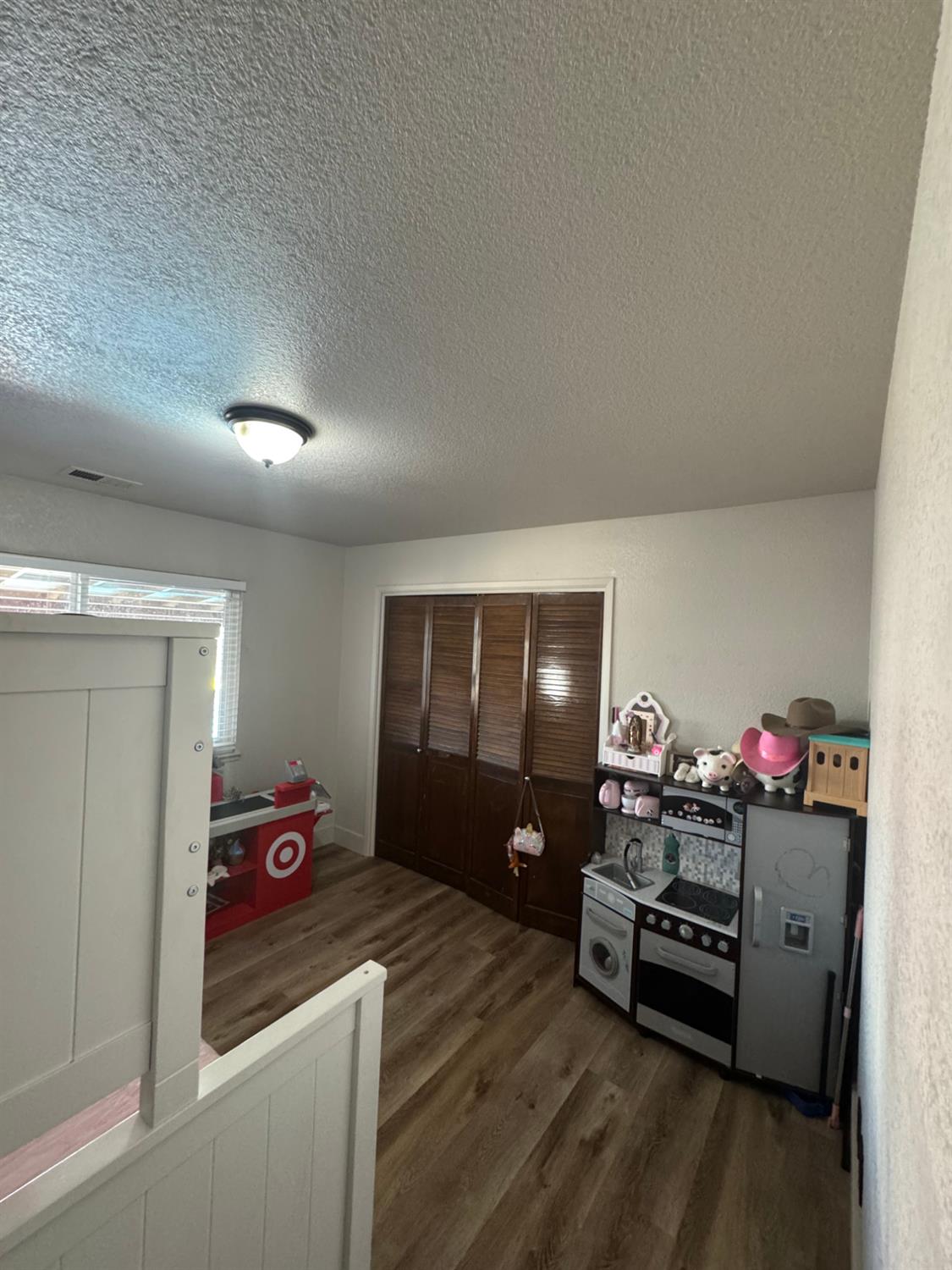 5931 Claribel Road Oakdale, CA 95361 - Photo 16 of 29 a room with furniture and a wooden floor