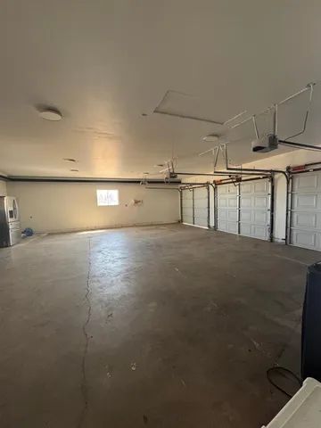 a view of parking garage with cars