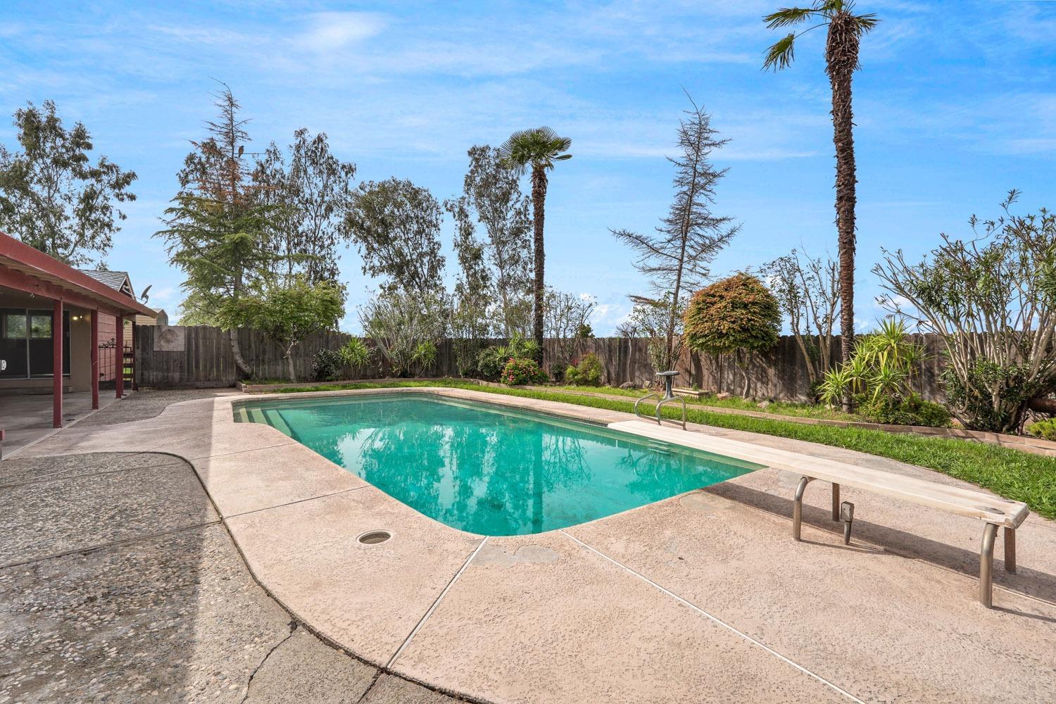 5931 Claribel Road Oakdale, CA 95361 - Photo 9 of 29 a view of a swimming pool with a lounge chairs