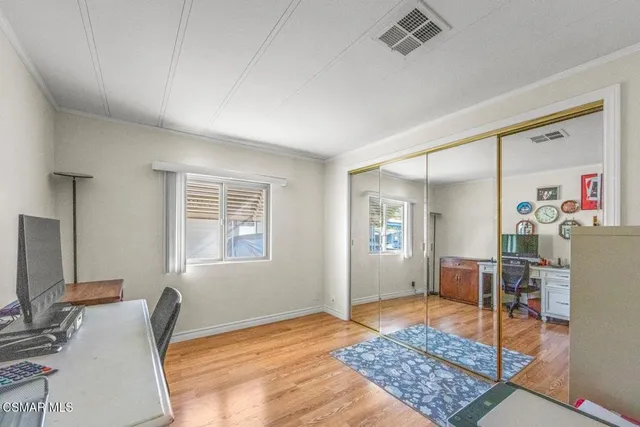 a bedroom with furniture and a window