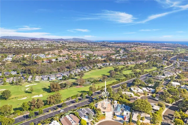 an aerial view of residential building and lake