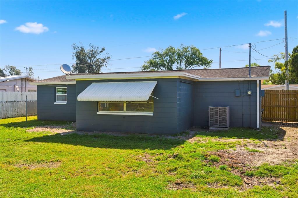 9033 Pegasus Avenue Port Richey, FL 34668 - Photo 41 of 56 a view of outdoor space yard and garage