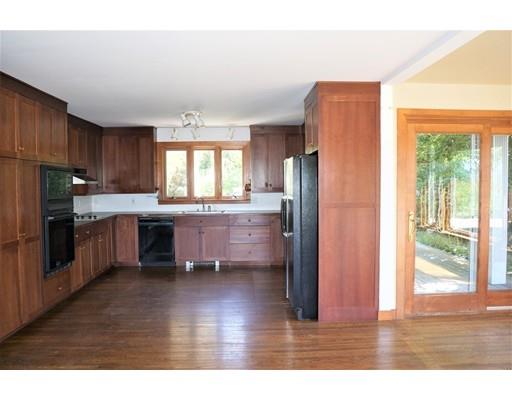 232 Still River Road Harvard, MA 01451 - Photo 15 of 41 a kitchen with granite countertop wooden floors and stainless steel appliances