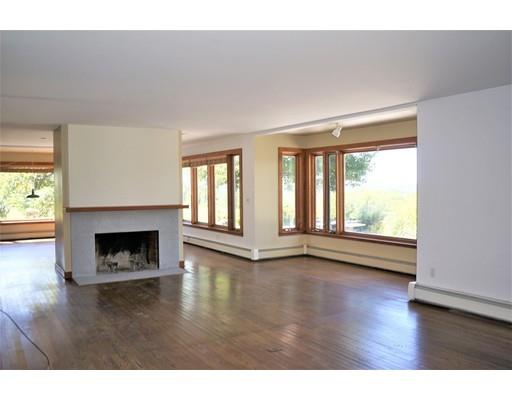 232 Still River Road Harvard, MA 01451 - Photo 19 of 41 a view of an empty room with wooden floor and a window