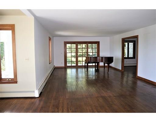 232 Still River Road Harvard, MA 01451 - Photo 22 of 41 a hallway with wooden floor table and chairs