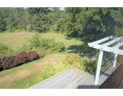 232 Still River Road Harvard, MA 01451 - Photo 33 of 41 a view of a yard with an outdoor seating