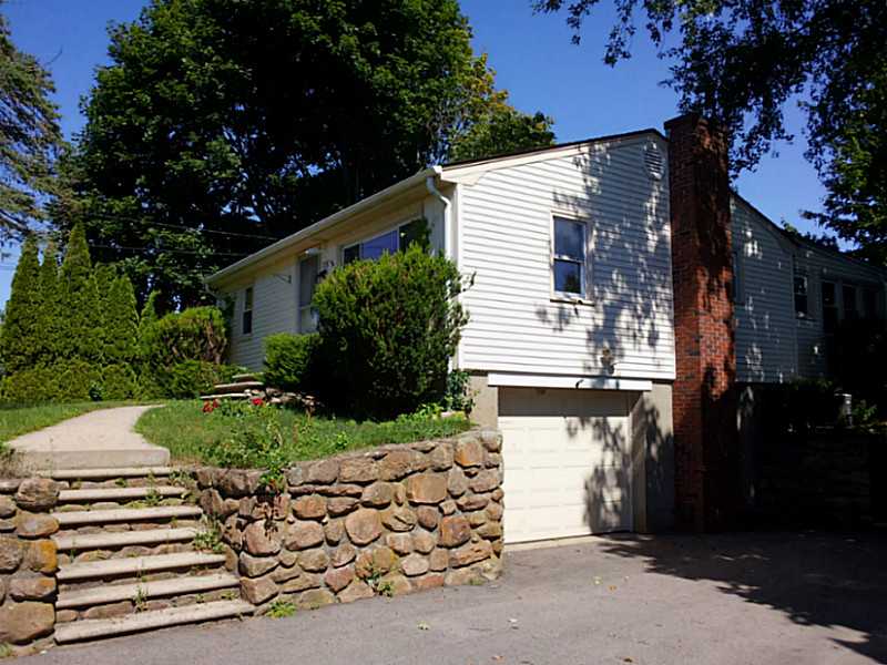 235 Foddering Farm Road Narragansett, RI 02882 - Photo 2 of 25 Exterior Front. Large paved driveway with beautiful stone walls and steps leading to main living level.