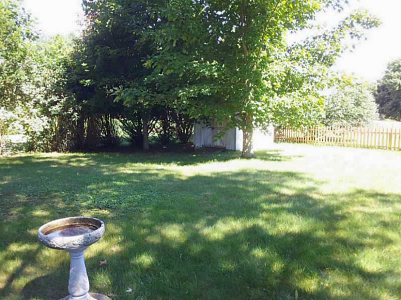 235 Foddering Farm Road Narragansett, RI 02882 - Photo 3 of 25 Exterior Back. Comfortable and level back yard with garden shed and good privacy