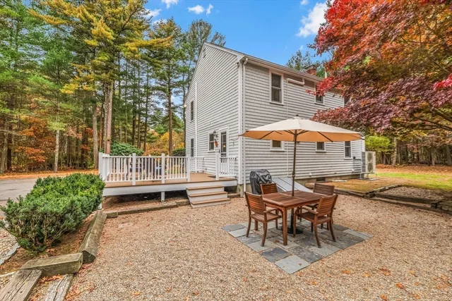 a outdoor space with a bench and chairs