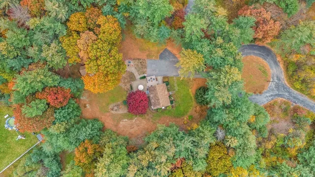 a view of a house with a yard and garden
