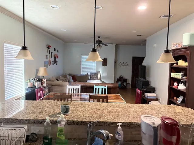 a very nice looking dining room with a table and chairs